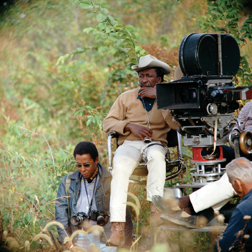 ROLE MODEL 2: Gordon Parks Jr. at the feet of his father while filming The Learning Tree. - photo © Warner Bros./Seven Arts, Inc. 